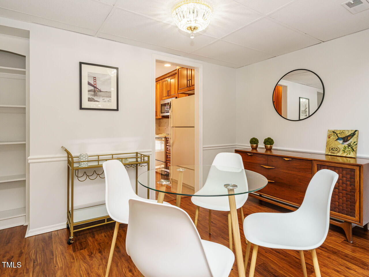 3125 Morningside Drive Raleigh, NC 27607 - Photo 10 of 26 a view of a dining room with furniture wooden floor and chandelier