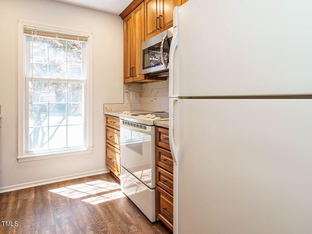 3125 Morningside Drive Raleigh, NC 27607 - Photo 12 of 26 a view of an empty room with a fireplace