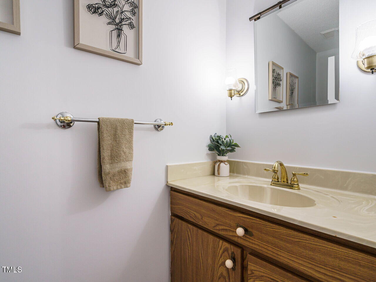 3125 Morningside Drive Raleigh, NC 27607 - Photo 14 of 26 a bathroom with a sink and a mirror