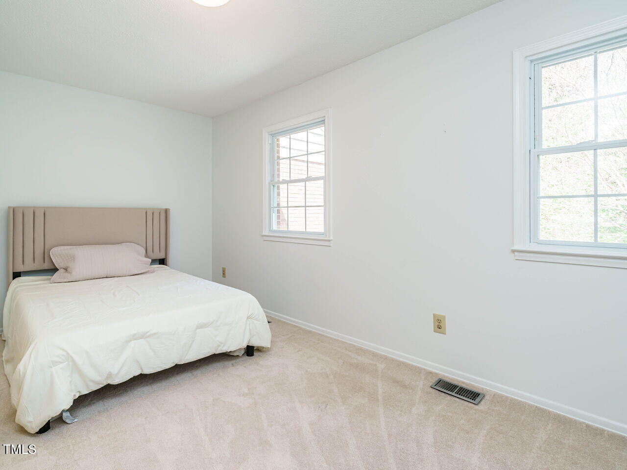 3125 Morningside Drive Raleigh, NC 27607 - Photo 20 of 26 a bedroom with a bed and window