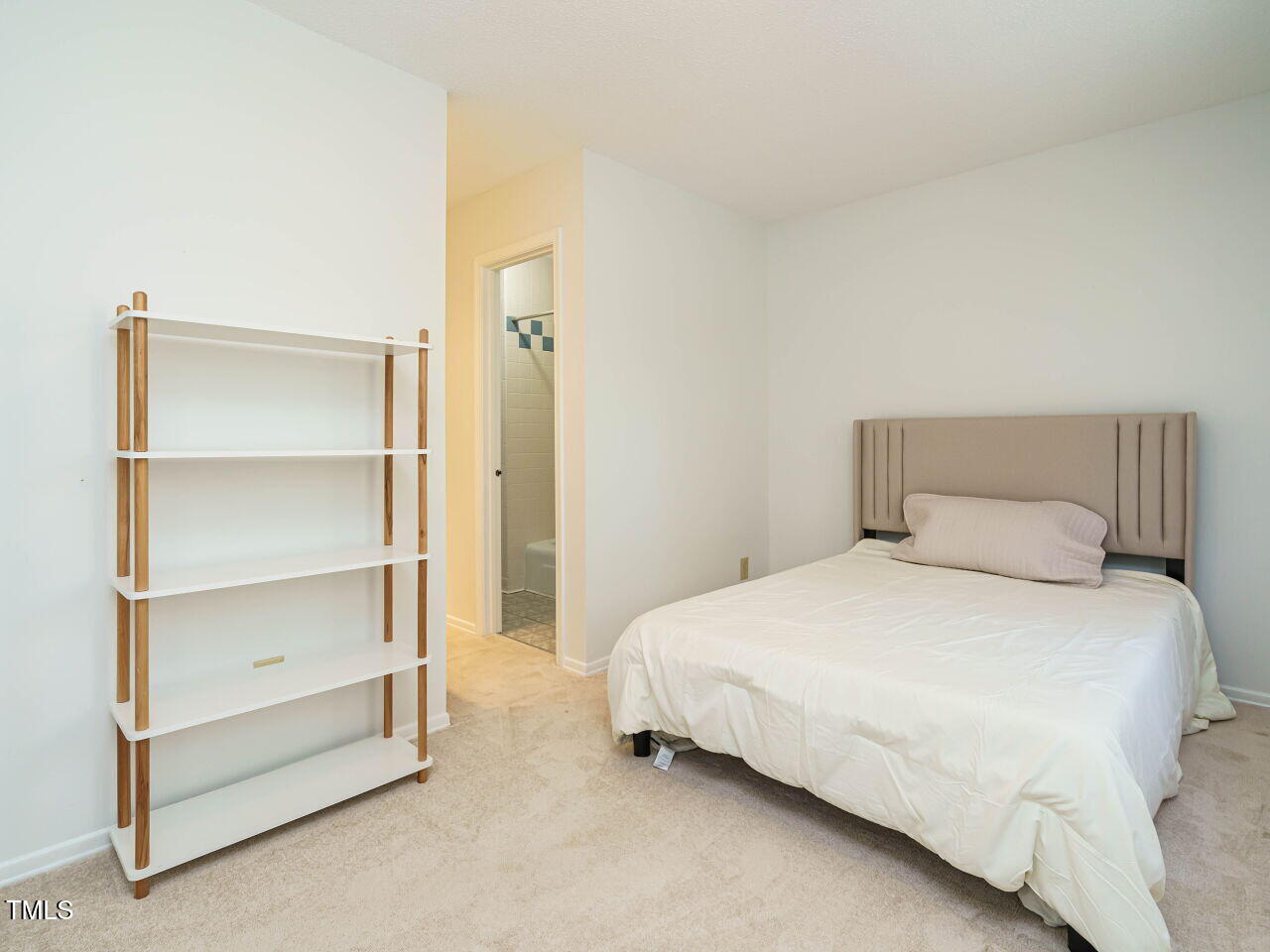 3125 Morningside Drive Raleigh, NC 27607 - Photo 21 of 26 a bedroom with a bed and a walk in closet