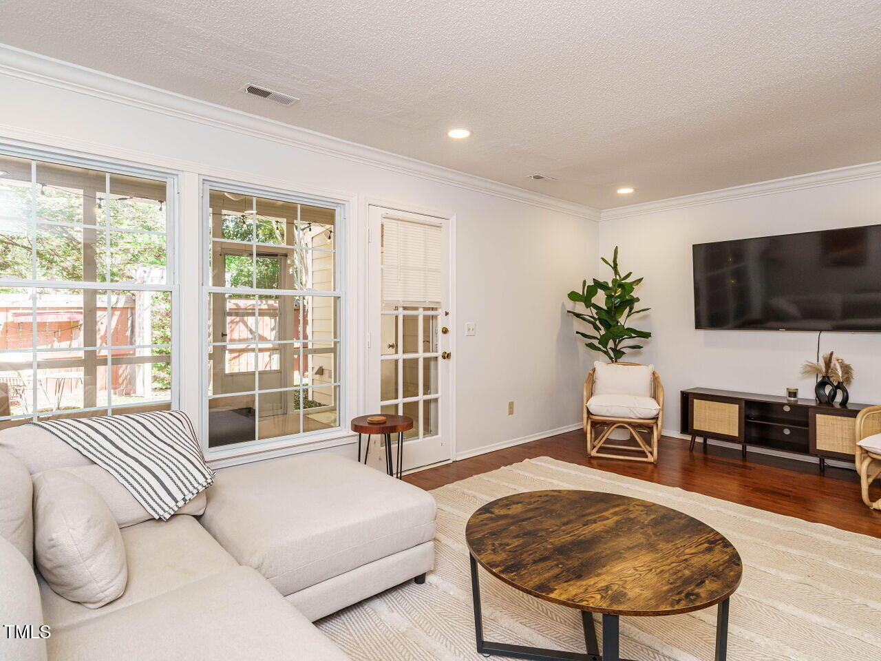 3125 Morningside Drive Raleigh, NC 27607 - Photo 6 of 26 a living room with furniture and a flat screen tv