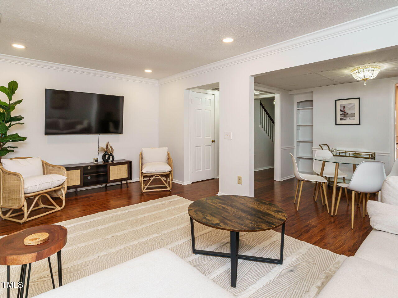 3125 Morningside Drive Raleigh, NC 27607 - Photo 7 of 26 a living room with furniture and a flat screen tv