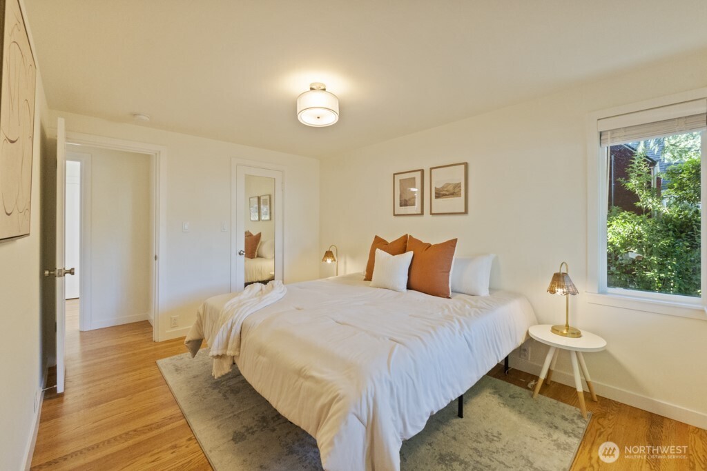 2646 34th Avenue West Seattle, WA 98199 - Photo 20 of 40 a bedroom with a bed and a table