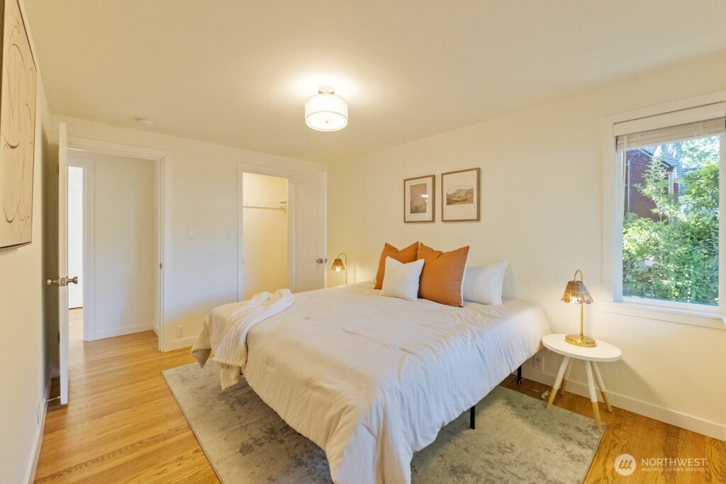 2646 34th Avenue West Seattle, WA 98199 - Photo 21 of 40 a bedroom with a bed and a table
