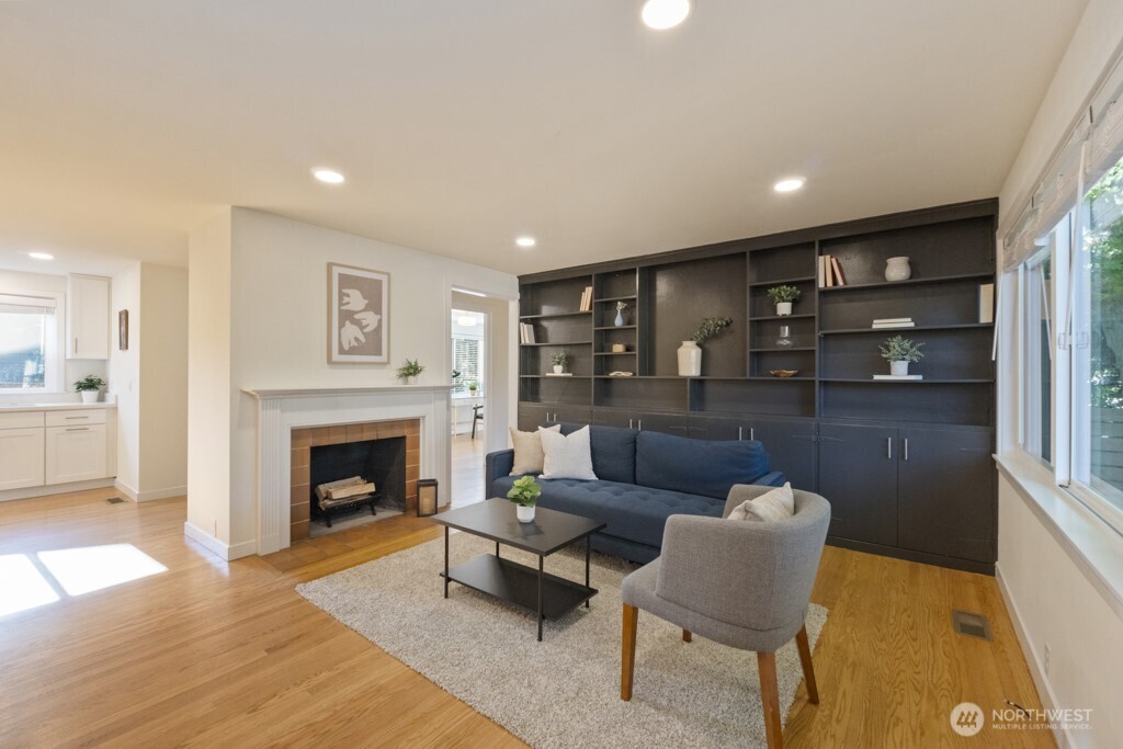 2646 34th Avenue West Seattle, WA 98199 - Photo 5 of 40 a living room with furniture and a fireplace