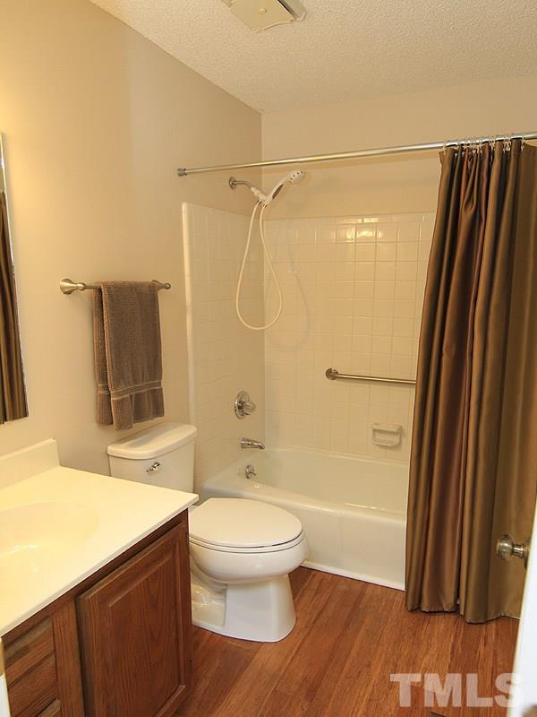 6705 Tattershale Court Raleigh, NC 27613 - Photo 11 of 13 New paint, faucet, bamboo flooring and comfort height toilet.