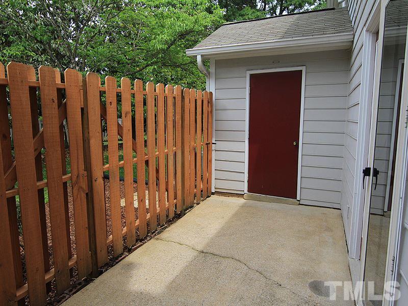 6705 Tattershale Court Raleigh, NC 27613 - Photo 12 of 13 Private, fenced (new 2014) patio with access to storage room.