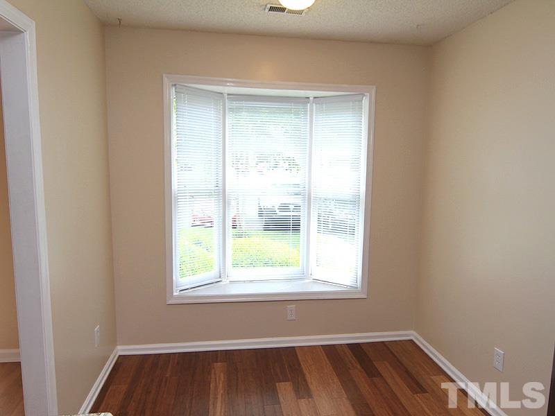 6705 Tattershale Court Raleigh, NC 27613 - Photo 3 of 13 Complete with new bamboo flooring and bright, bay window.