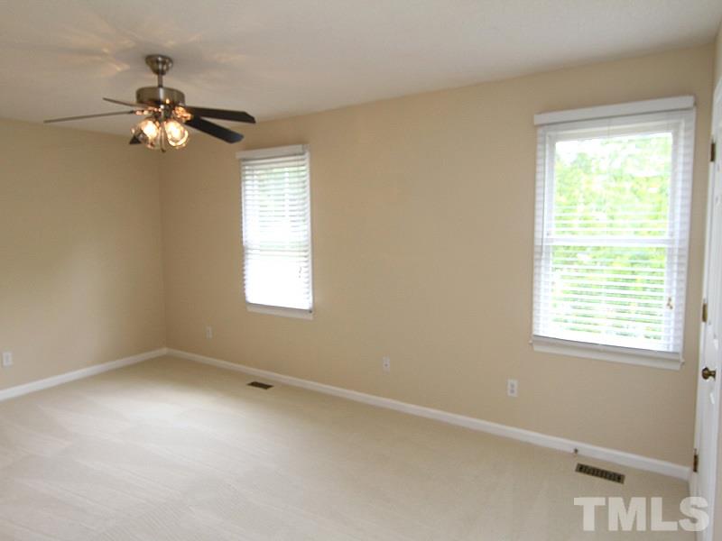 6705 Tattershale Court Raleigh, NC 27613 - Photo 7 of 13 Large, bright master with new ceiling fan, carpet and paint.