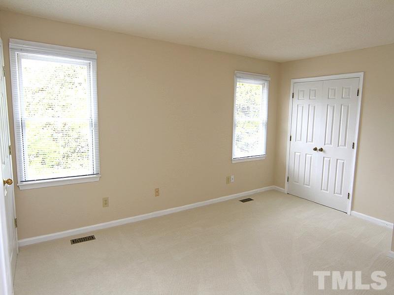 6705 Tattershale Court Raleigh, NC 27613 - Photo 10 of 13 Bright, large bedroom with new carpet, paint and private bath with bamboo flooring and comfort height toilet.