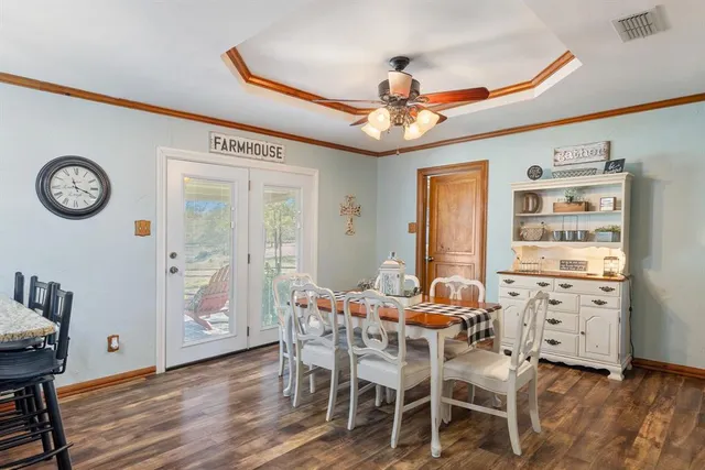 a large bathroom with a tub a sink and a large mirror