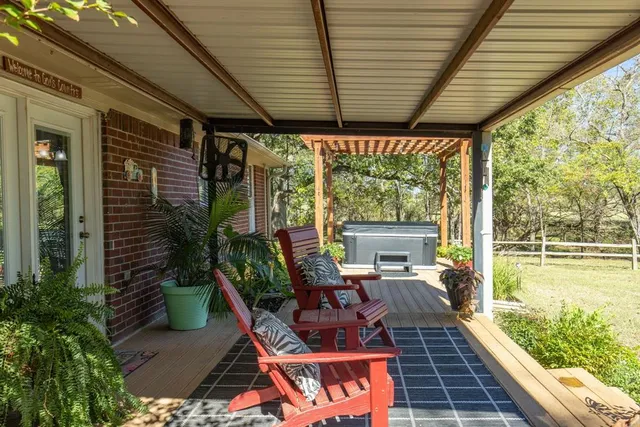 a patio with table and chairs