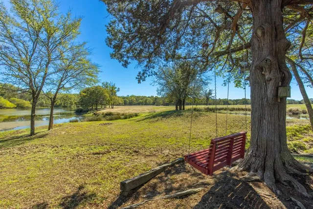 a view of a lake with a yard