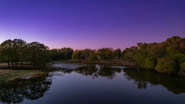 a view of lake with green space