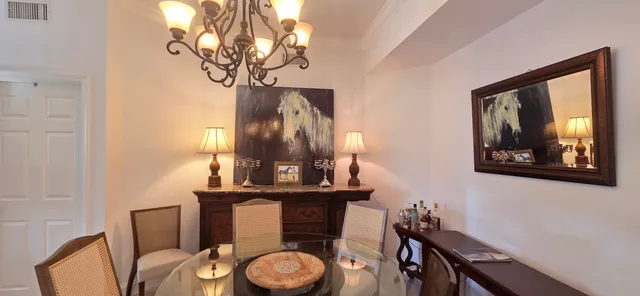 a bathroom with a toilet mirror and vanity