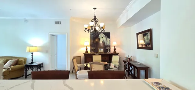 a kitchen with stainless steel appliances granite countertop a sink a stove a refrigerator and cabinets