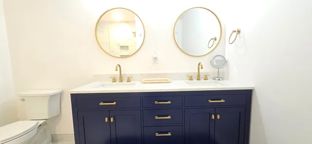 a living room with furniture and a lamp