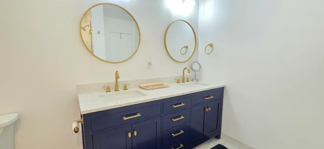 a living room with furniture a window and a chandelier