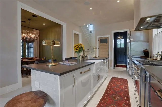 a kitchen with a sink and cabinets