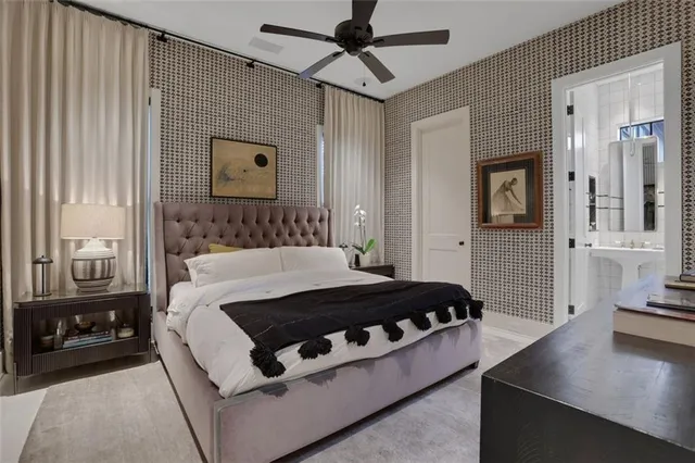 a living room with a bed furniture and a flat tv screen