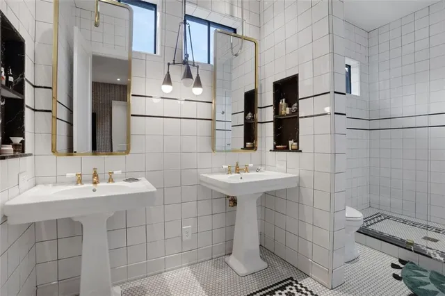 a bathroom with a sink and mirror