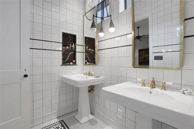 a bathroom with a sink and mirror