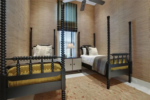 a bedroom with a bed and a night stand