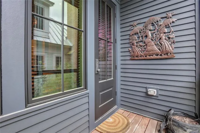 a view of a door and a window