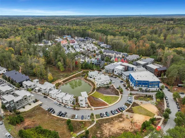 an aerial view of a house with a ocean view