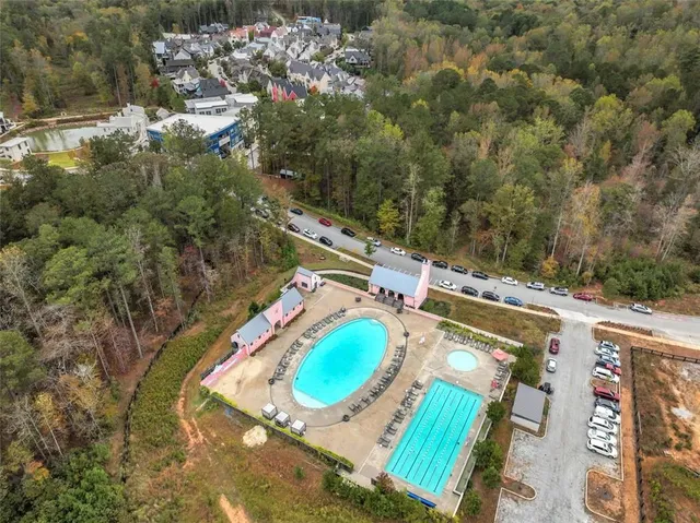 an aerial view of a house with a swimming pool
