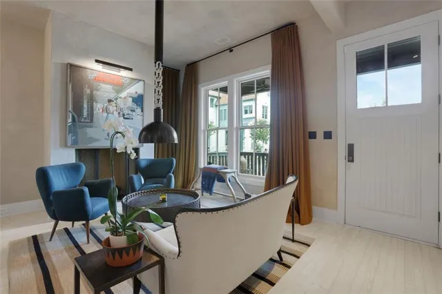 a living room with furniture and a large window