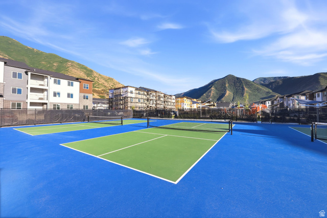 4646 Alder Drive, Unit 223 Mapleton, UT 84664 - Photo 24 of 35 Multiple tennis courts with blue and green surfacing