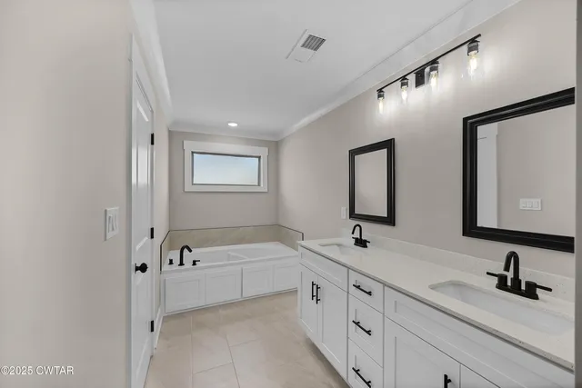 a bathroom with double sink and three mirror