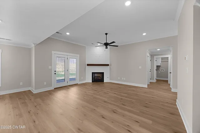 a view of a kitchen with a sink and a fireplace