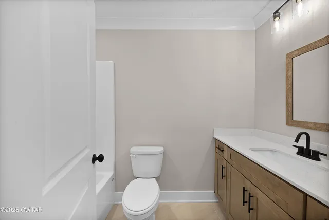 a kitchen with kitchen island a sink appliances and cabinets