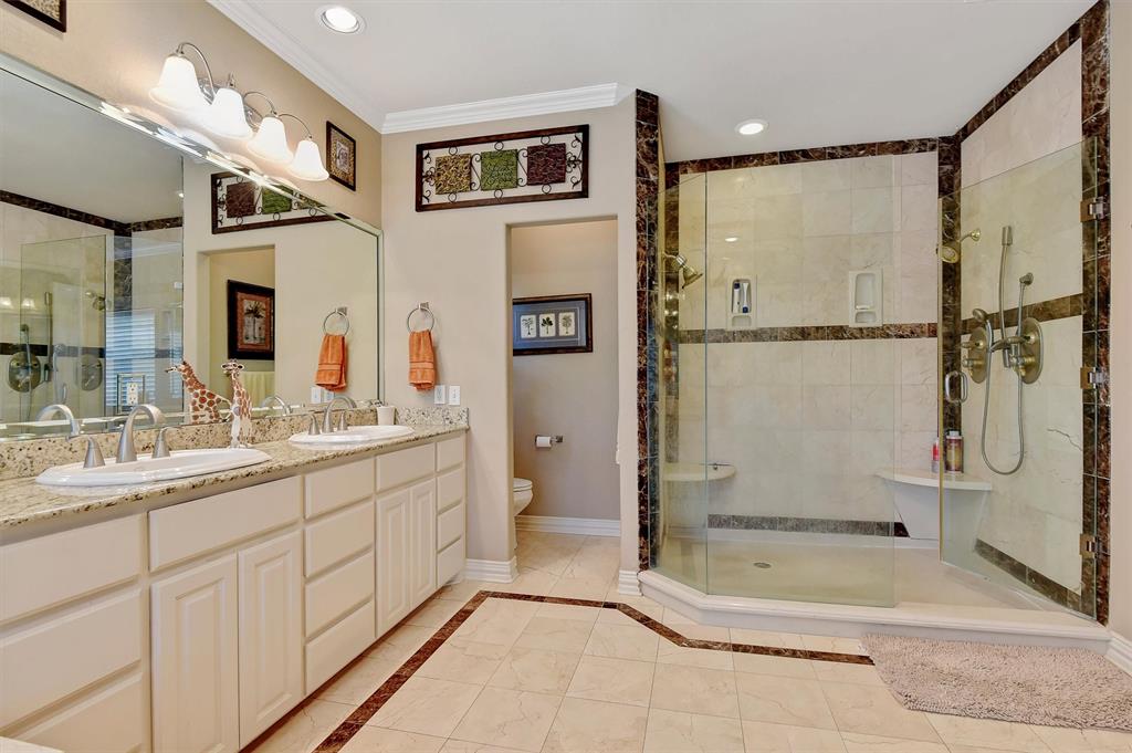 297 Cemetery Road Pottsboro, TX 75076 - Photo 13 of 40 Bathroom with toilet, vanity, and walk in shower