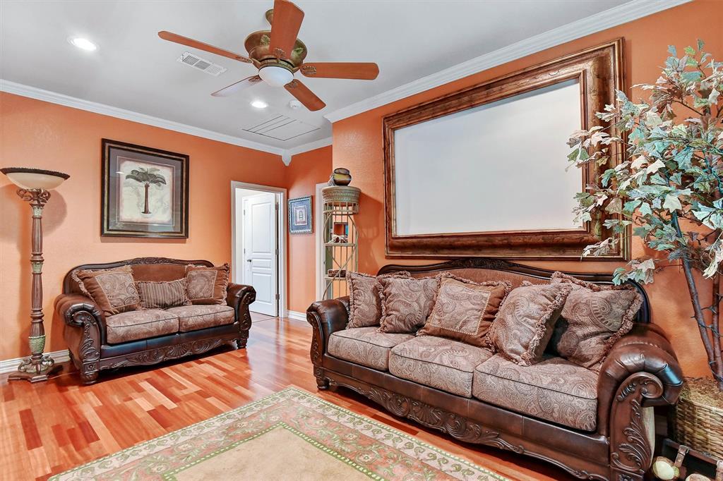 297 Cemetery Road Pottsboro, TX 75076 - Photo 14 of 40 Upstairs Living room featuring hardwood / wood-style flooring, ceiling fan, and ornamental molding