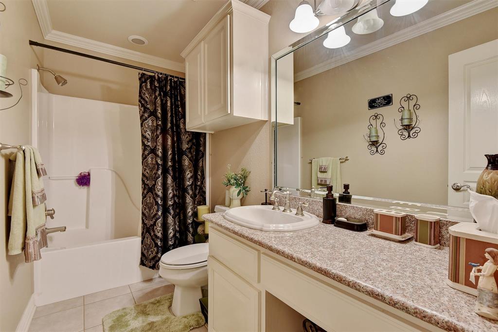 297 Cemetery Road Pottsboro, TX 75076 - Photo 19 of 40 Full bathroom featuring shower / bath combination with curtain, vanity, tile patterned floors, and crown molding