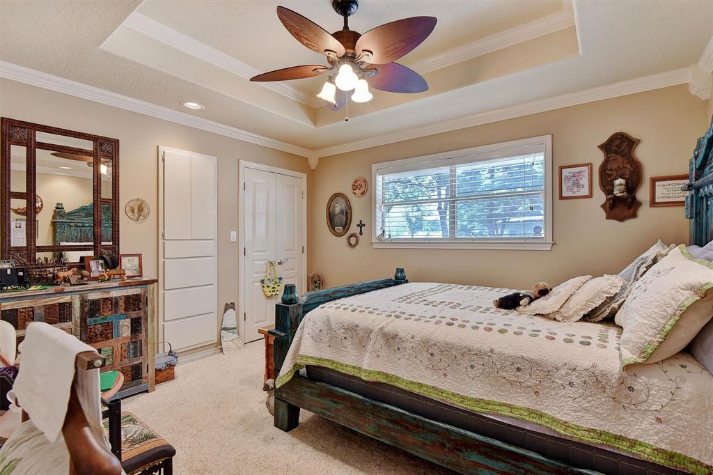 297 Cemetery Road Pottsboro, TX 75076 - Photo 21 of 40 Bedroom featuring a raised ceiling, ceiling fan, and crown molding