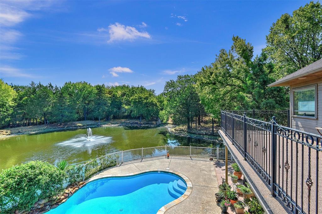 297 Cemetery Road Pottsboro, TX 75076 - Photo 25 of 40 View of pool featuring a water view