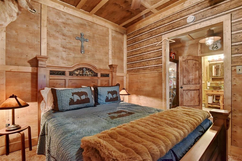 297 Cemetery Road Pottsboro, TX 75076 - Photo 34 of 40 Bedroom with wooden walls and wood ceiling in Party Barn