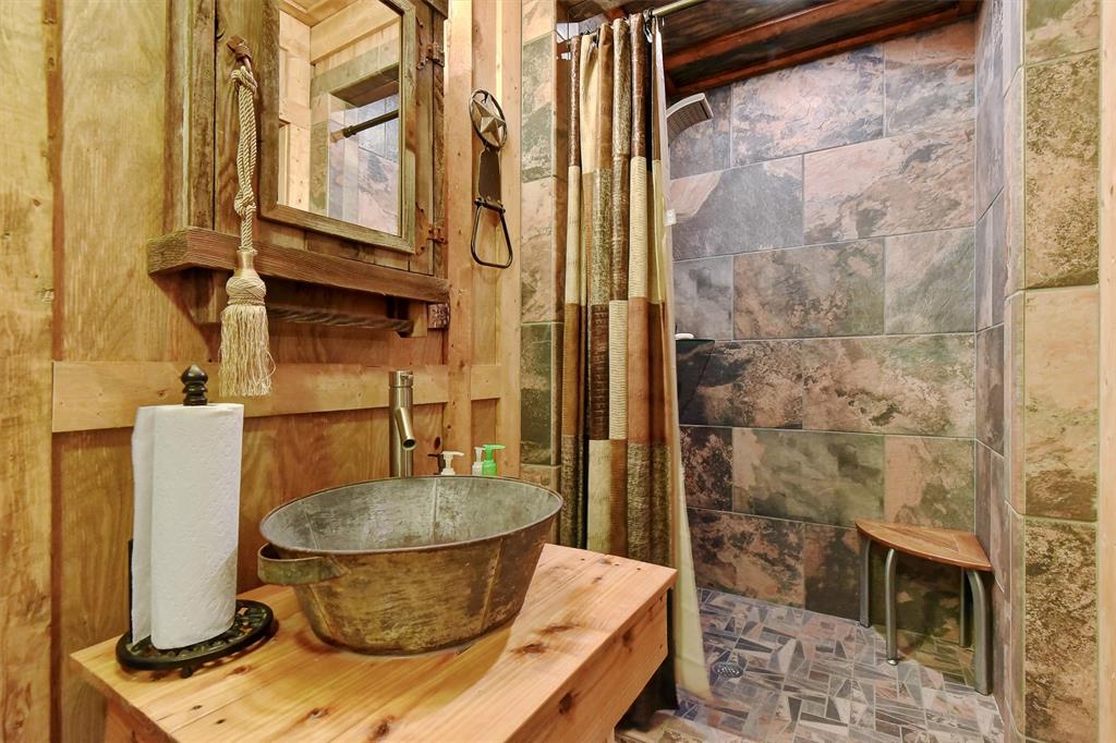 297 Cemetery Road Pottsboro, TX 75076 - Photo 35 of 40 Bathroom featuring sink and shower in Party Barn