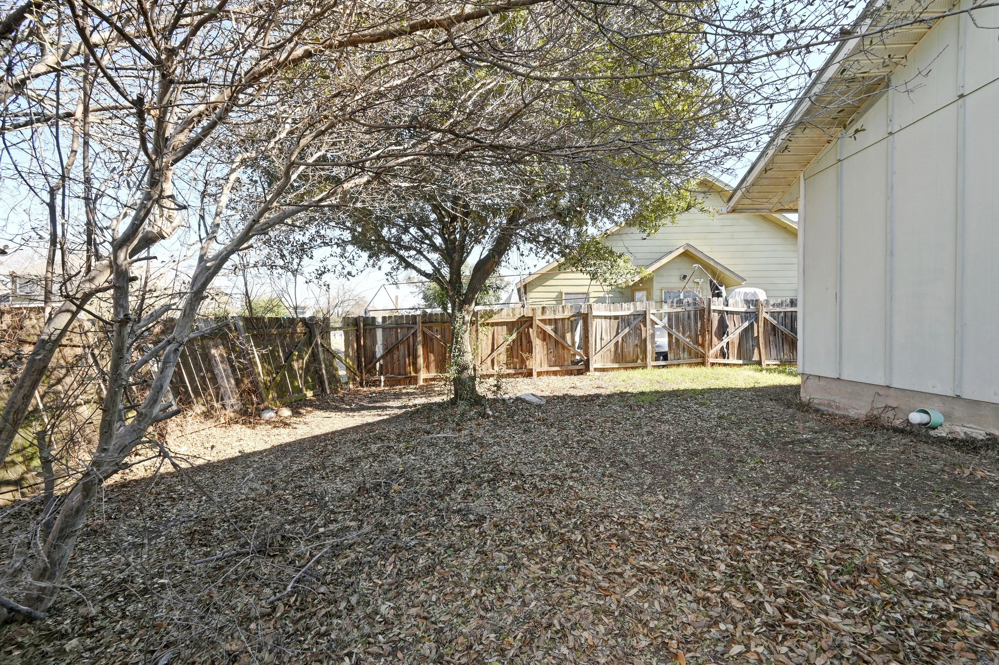 6901 Frontera Trail Austin, TX 78741 - Photo 21 of 21 a view of a yard with a house