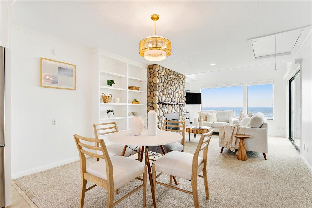 101 Shell Road, Unit 62 Watsonville, CA 95076 - Photo 8 of 38 a view of a dining room with furniture and chandelier