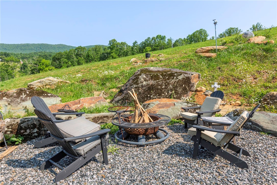509 Grant Houck Road Todd, NC 28684 - Photo 42 of 43 a view of a backyard with plants and outdoor seating