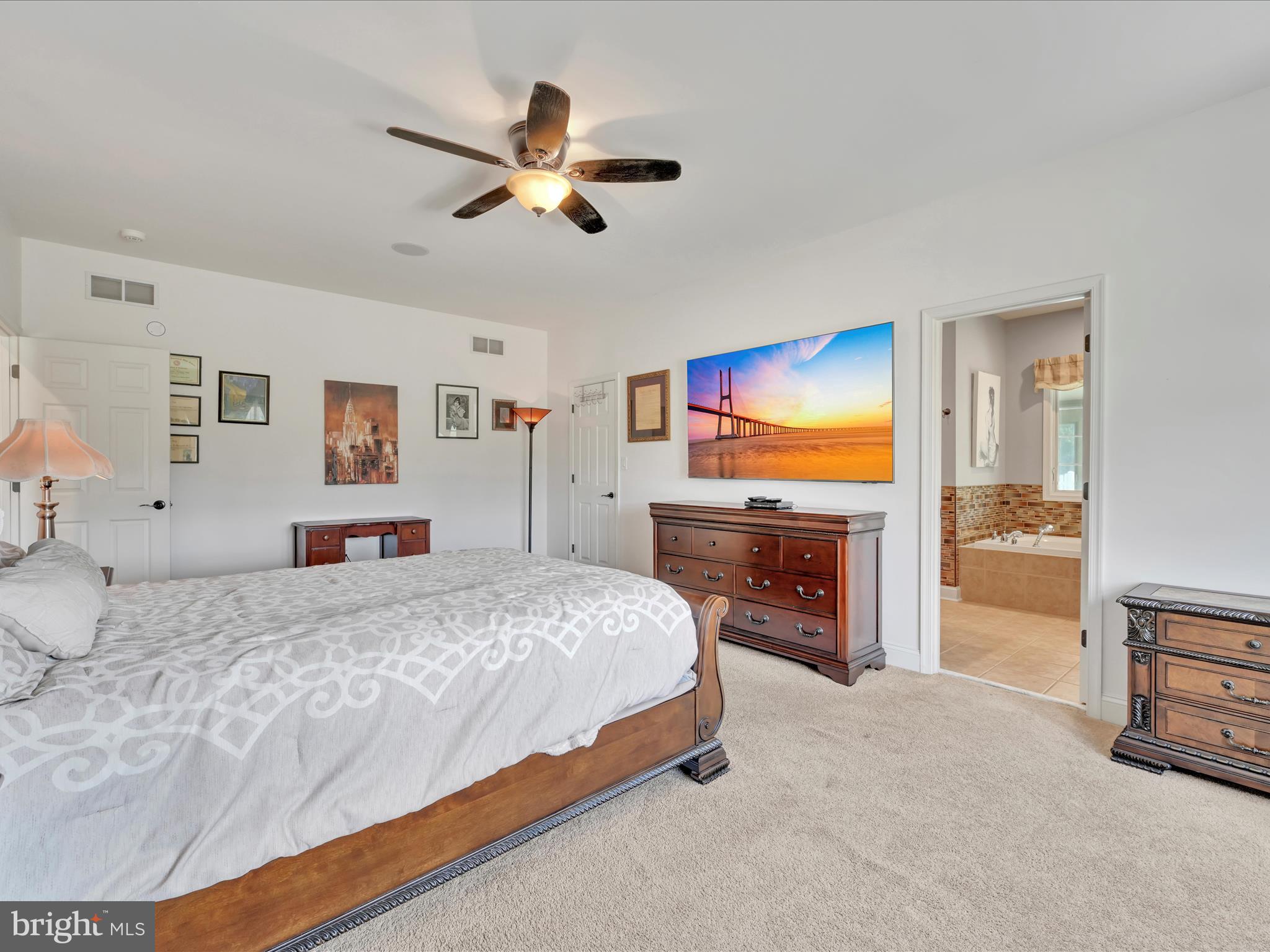 1120 Suedberg Road Pine Grove, PA 17963 - Photo 15 of 75 a spacious bedroom with a bed and a chandelier