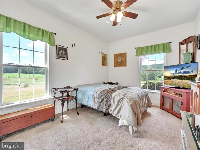 a view of an empty room with a fireplace
