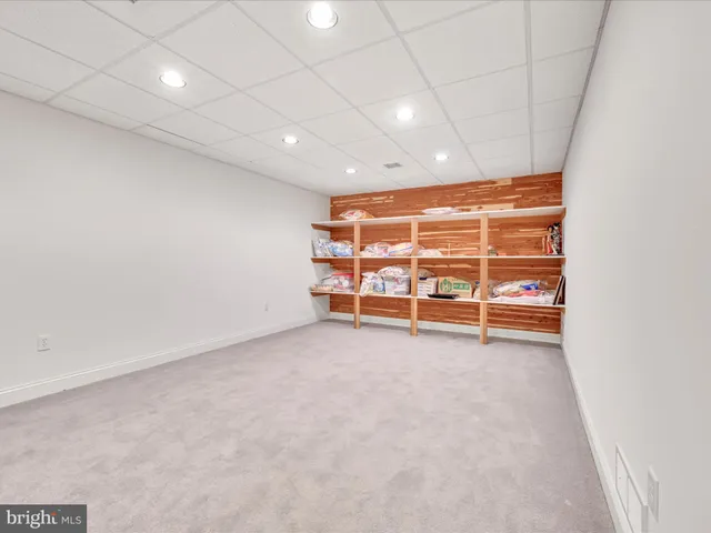 a living room with lots of furniture and a flat screen tv