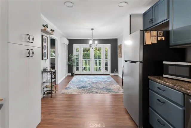 a view of a kitchen with a stove cabinets and a wooden floor